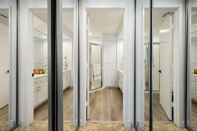 a view of a bathroom from a hallway