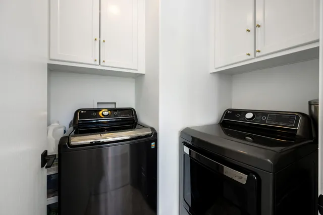 a kitchen with wooden cabinets stainless steel appliances and a sink