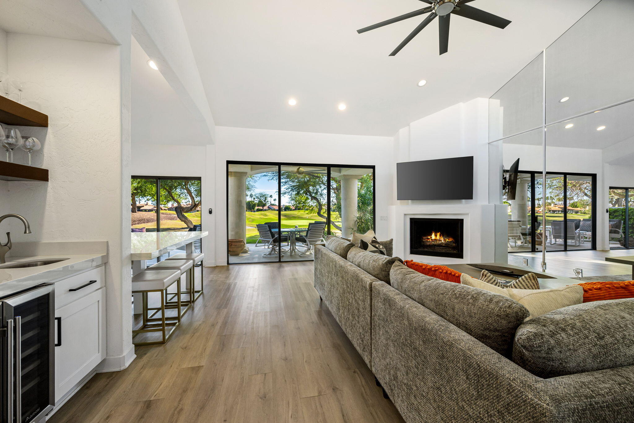 54524 Inverness Way La Quinta, CA 92253 - Photo 10 of 48 a living room with furniture fireplace and flat screen tv