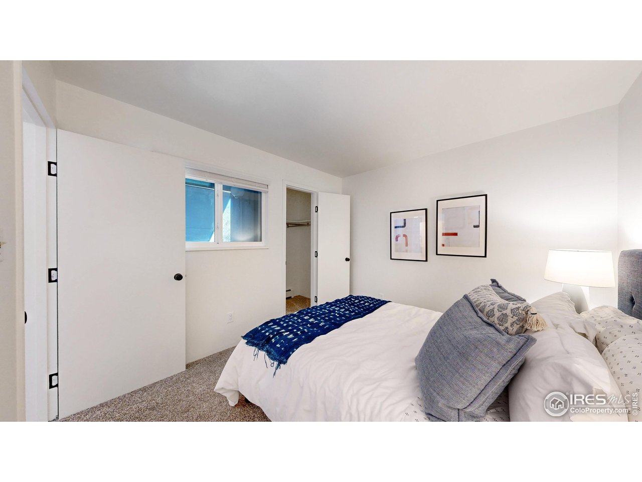 801 East Drake Road, Unit 80 Fort Collins, CO 80525 - Photo 14 of 25 Walk-in closet in the second bedroom. This spacious closet offers ample storage and organization for clothing and accessories, enhancing the functionality and comfort of the second bedroom.