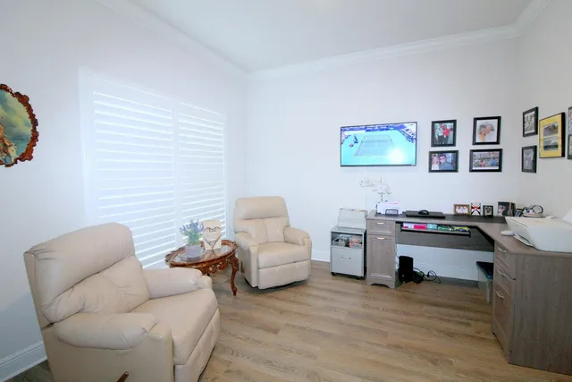 a bedroom with a bed and a table