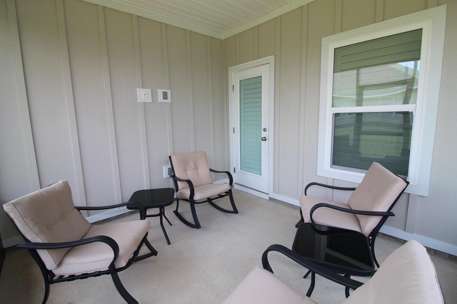 454 Lightning Bug Lane Freeport, FL 32439 - Photo 27 of 41 a view of a workspace room with lounge chair and windows