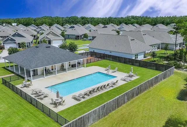 an aerial view of a house with a garden