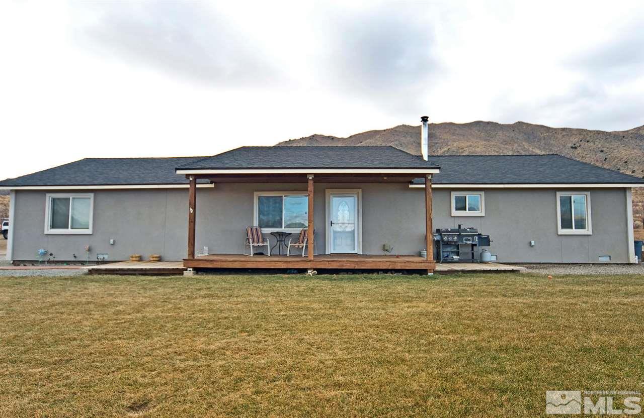 25 Prairie Way Reno, NV 89506 - Photo 3 of 16 a front view of a house with a garden
