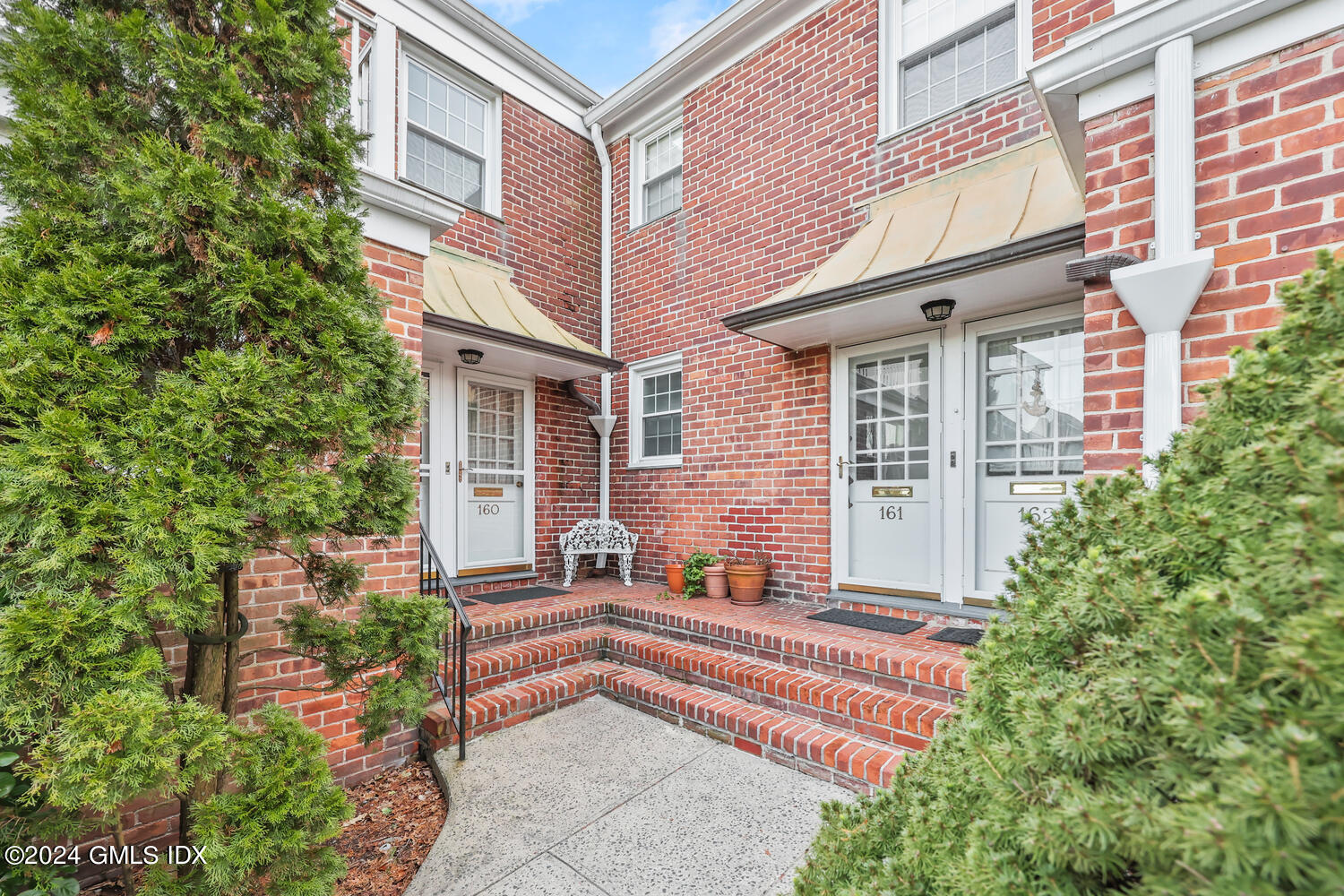 front view of a house with a garden