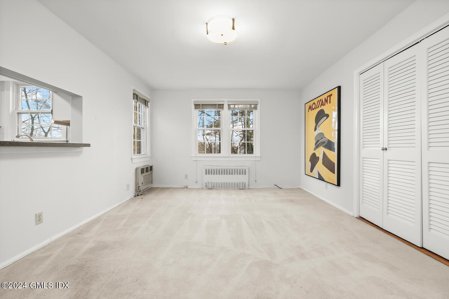 160 Putnam Park Greenwich, CT 06830 - Photo 12 of 27 an empty room with windows and cabinet