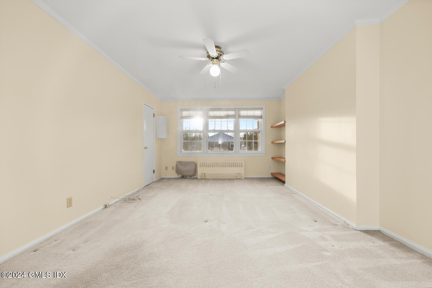 160 Putnam Park Greenwich, CT 06830 - Photo 15 of 27 an empty room with windows and ceiling fan view