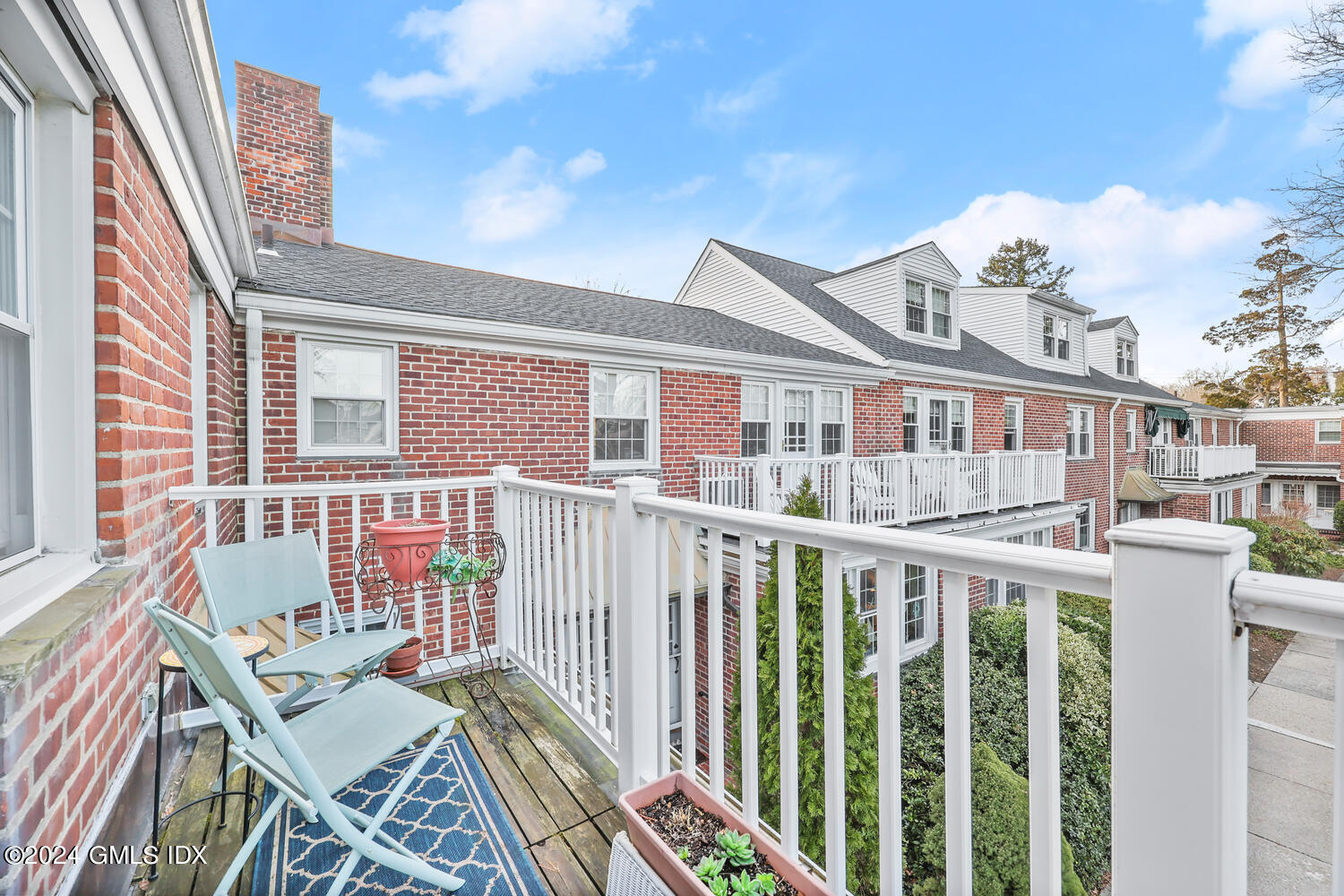 160 Putnam Park Greenwich, CT 06830 - Photo 22 of 27 a view of a brick house with a large window