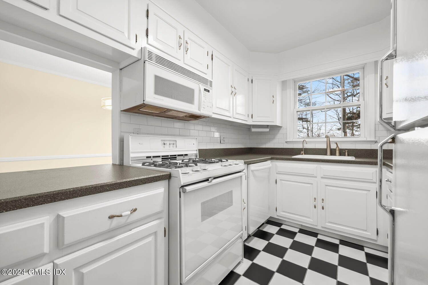 160 Putnam Park Greenwich, CT 06830 - Photo 7 of 27 a kitchen with stainless steel appliances granite countertop a sink and a stove