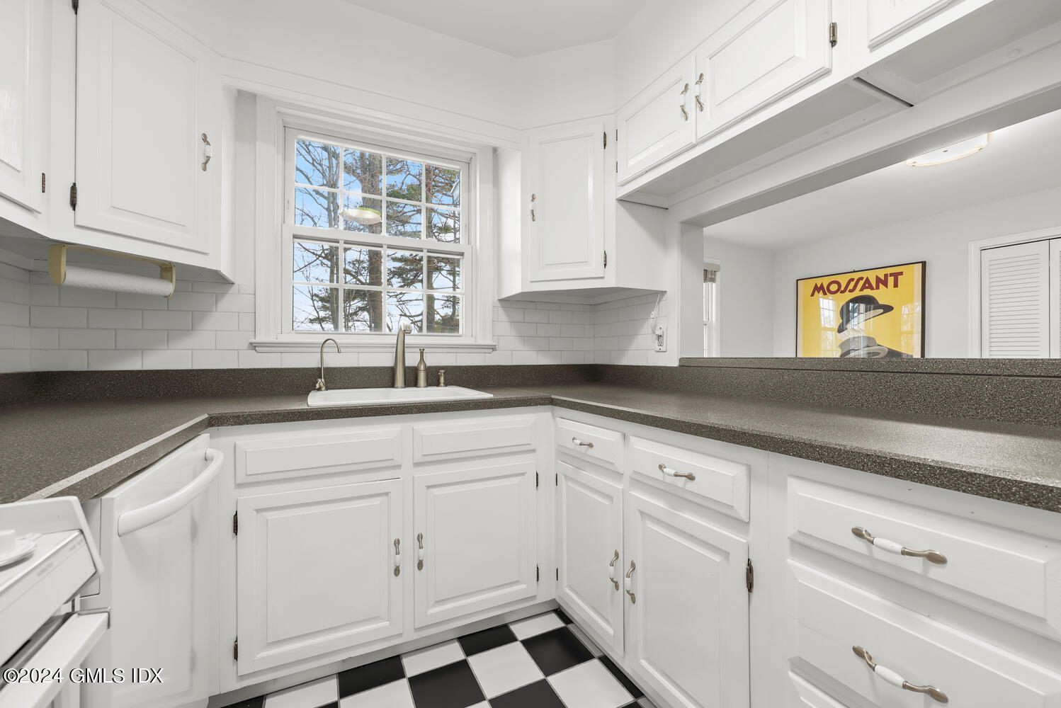 160 Putnam Park Greenwich, CT 06830 - Photo 9 of 27 a kitchen with white cabinets and sink