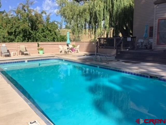 a view of a yard with a sitting space
