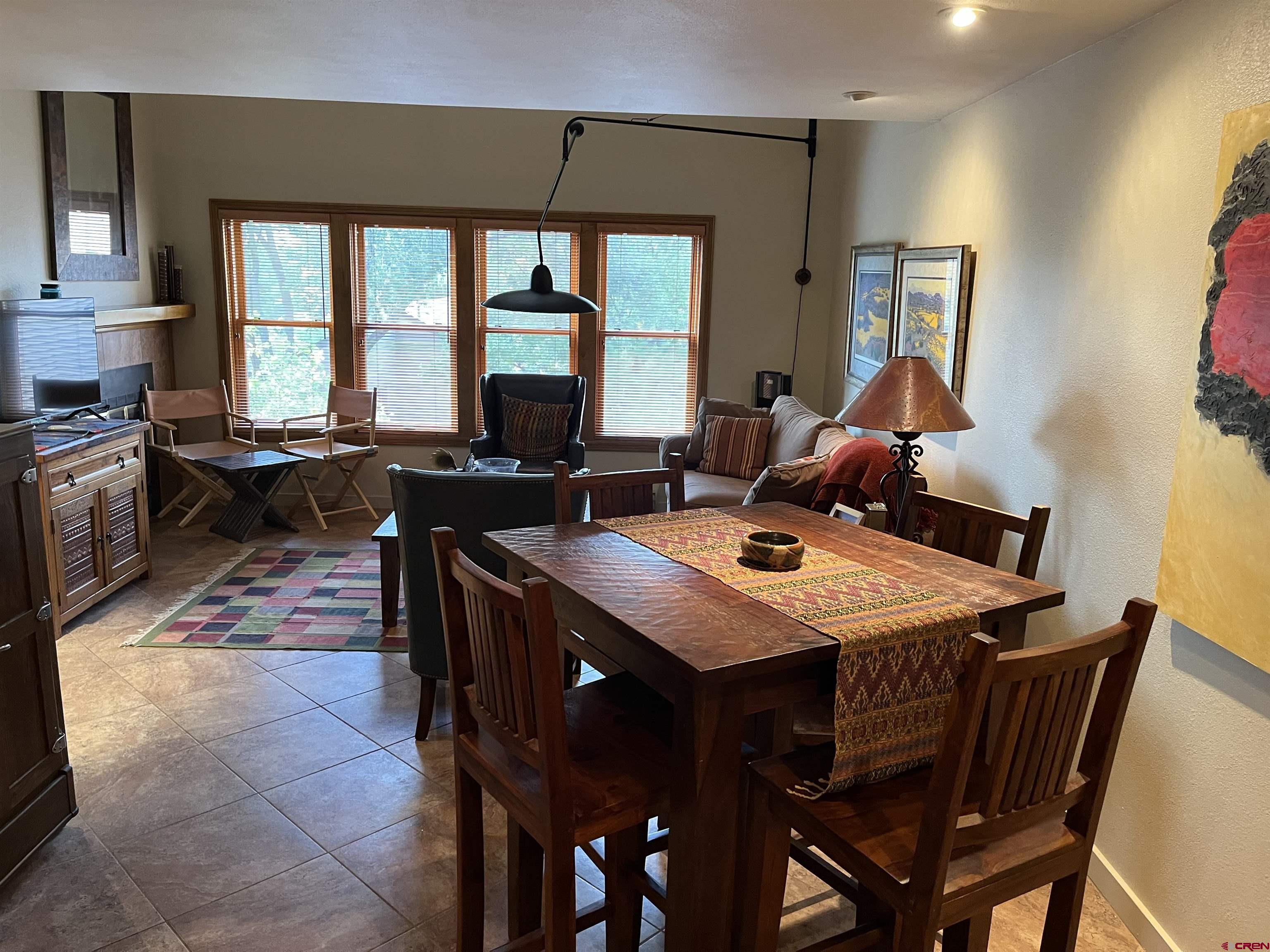 6 Ferringway Circle, Unit 22 Durango, CO 81301 - Photo 3 of 15 a view of a dining room with furniture and a large window