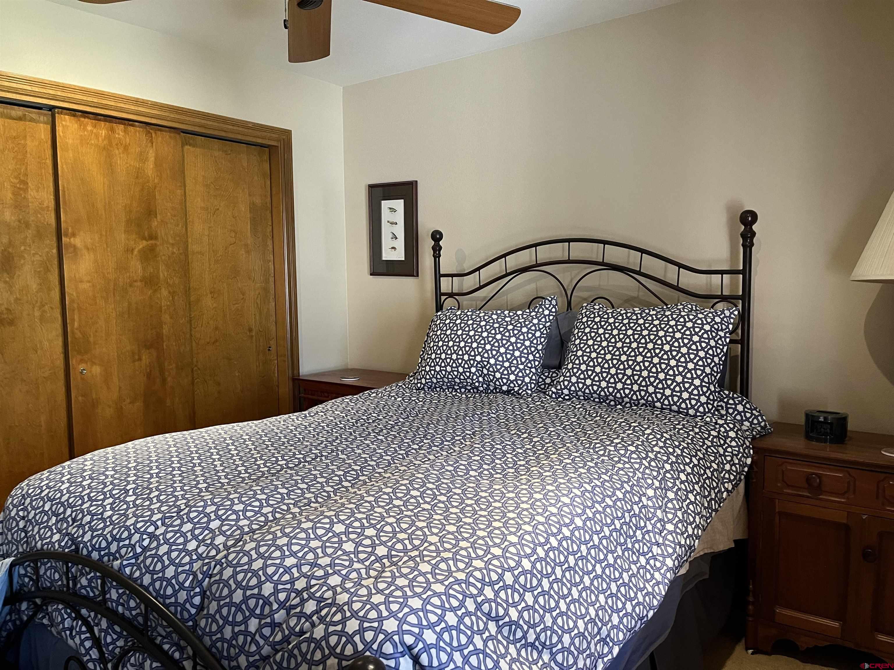 6 Ferringway Circle, Unit 22 Durango, CO 81301 - Photo 8 of 15 a bedroom with a bed and wooden floor