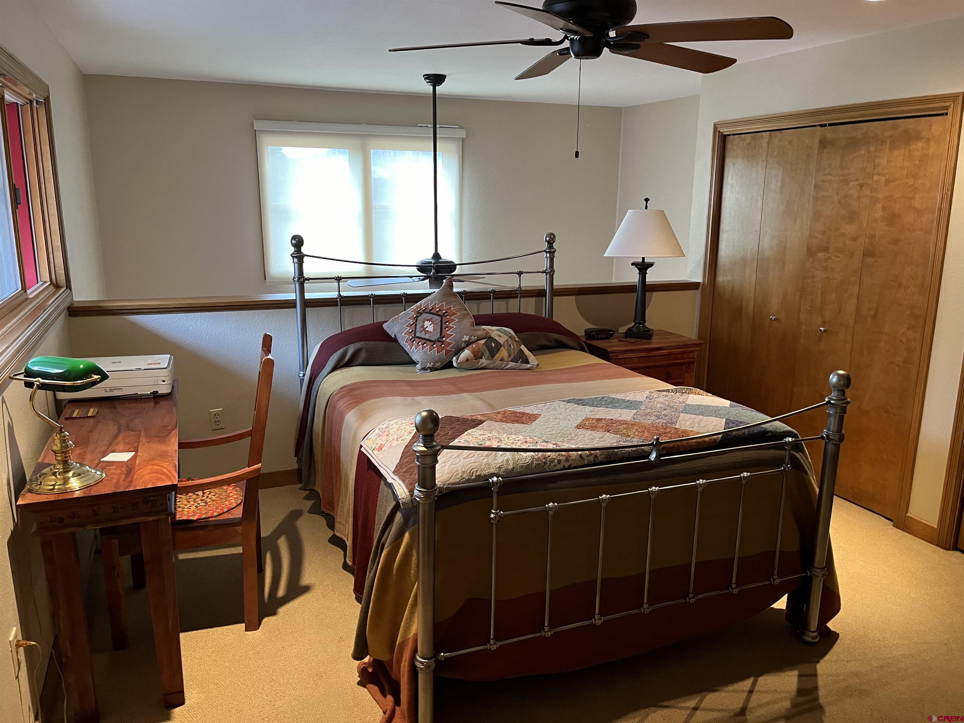 6 Ferringway Circle, Unit 22 Durango, CO 81301 - Photo 10 of 15 a bed sitting in a room next to a window