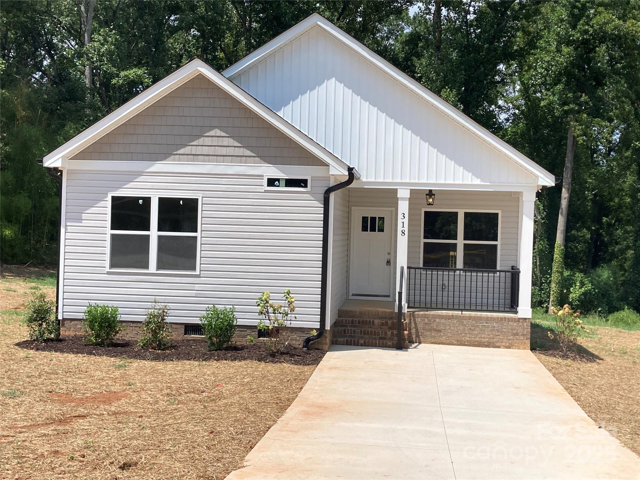 a front view of a house with garage