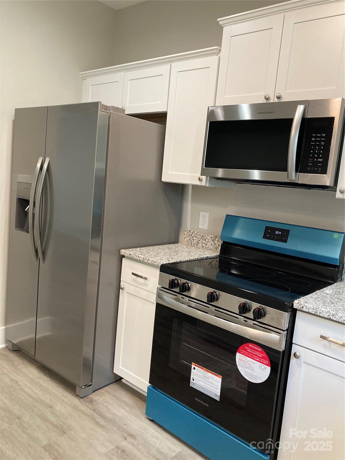 318 Davis Park Road Gastonia, NC 28052 - Photo 11 of 24 a stove top oven sitting inside of a kitchen