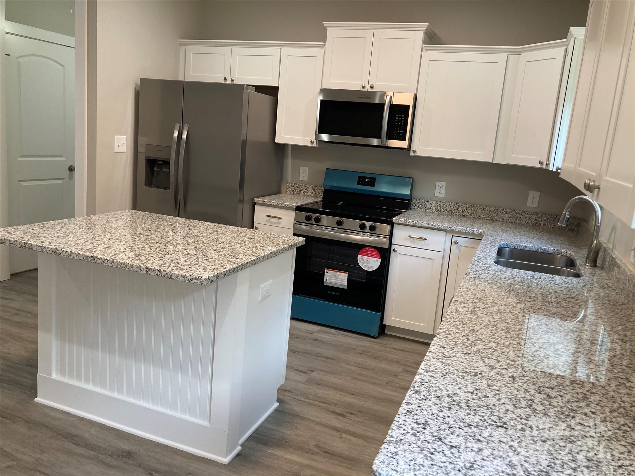 318 Davis Park Road Gastonia, NC 28052 - Photo 13 of 24 a kitchen with stainless steel appliances granite countertop a refrigerator stove and microwave