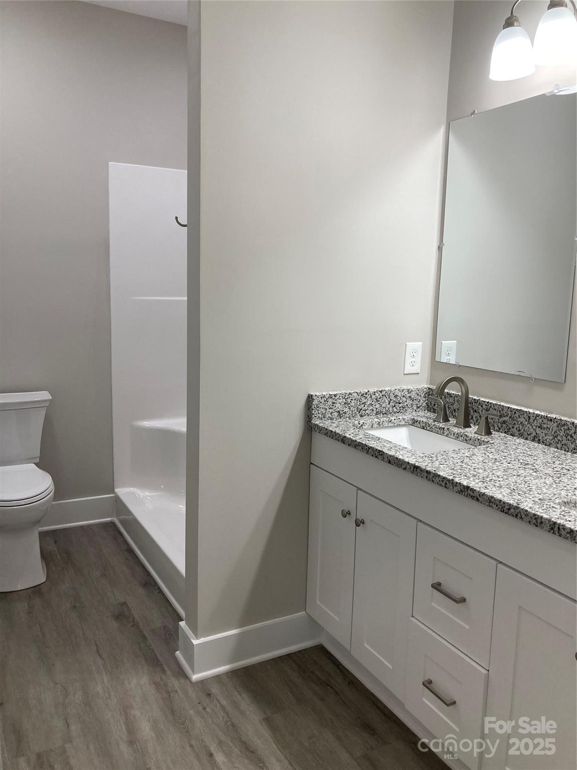 318 Davis Park Road Gastonia, NC 28052 - Photo 16 of 24 a bathroom with a granite countertop sink and toilet