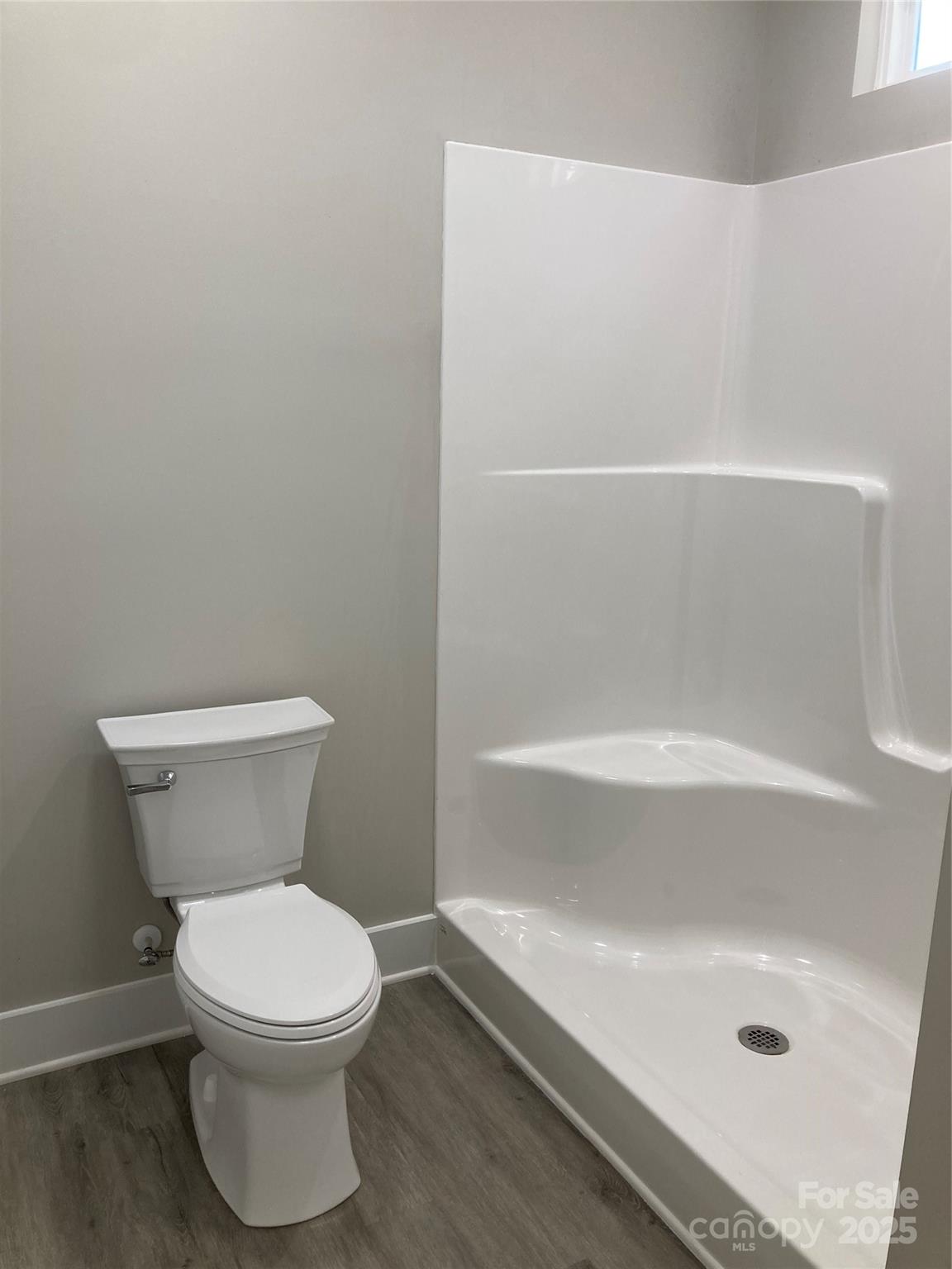 318 Davis Park Road Gastonia, NC 28052 - Photo 18 of 24 a bathroom with a toilet and a bathtub