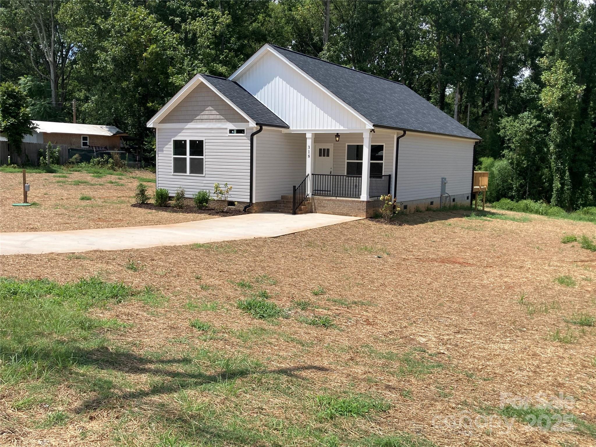 318 Davis Park Road Gastonia, NC 28052 - Photo 2 of 24 a view of a house with a yard