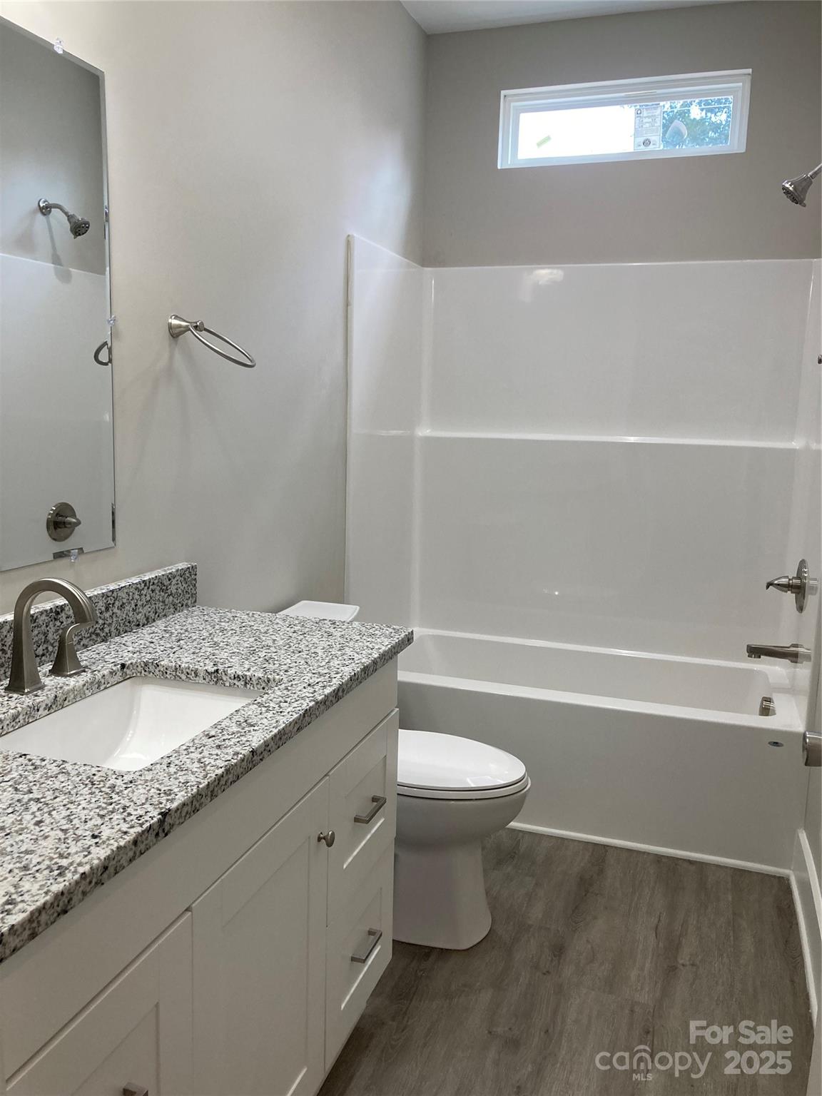 318 Davis Park Road Gastonia, NC 28052 - Photo 22 of 24 a bathroom with a granite countertop bathtub sink vanity mirror and toilet