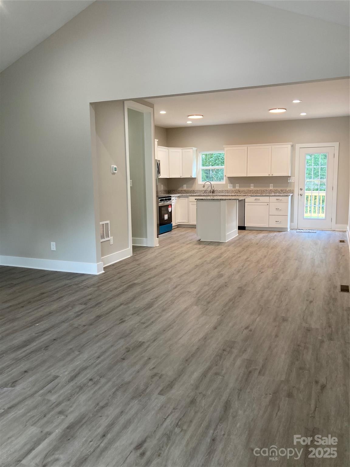 318 Davis Park Road Gastonia, NC 28052 - Photo 7 of 24 a view of a kitchen with a sink and a window