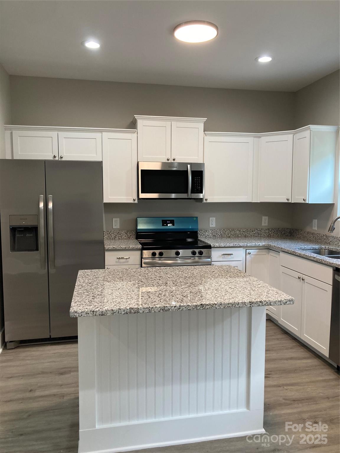 318 Davis Park Road Gastonia, NC 28052 - Photo 10 of 24 a kitchen with stainless steel appliances granite countertop a sink a stove and a refrigerator