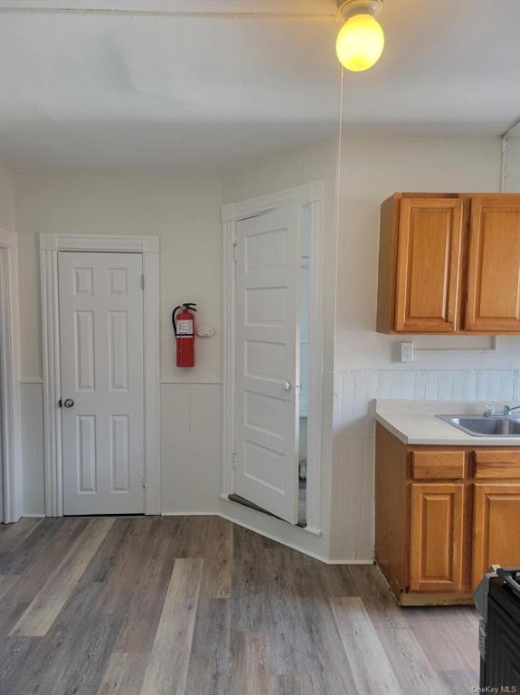 5-13 Academy Street Poughkeepsie, NY 12601 - Photo 11 of 11 Kitchen featuring range, sink, and light wood-type flooring