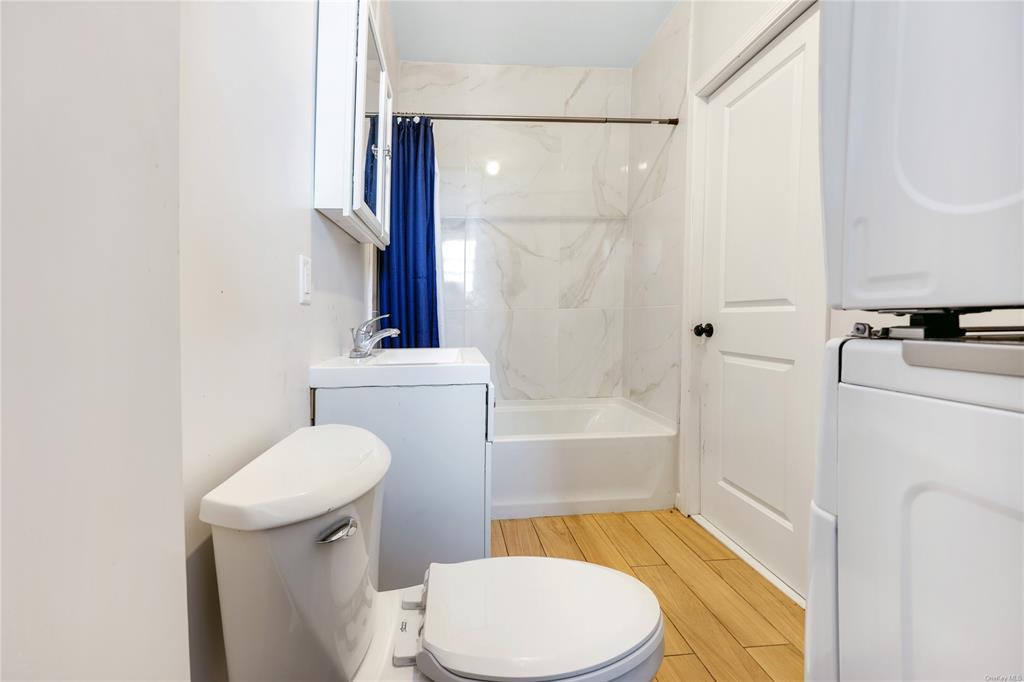 5-13 Academy Street Poughkeepsie, NY 12601 - Photo 9 of 11 Full bathroom with toilet, hardwood / wood-style floors, shower / tub combo, and sink