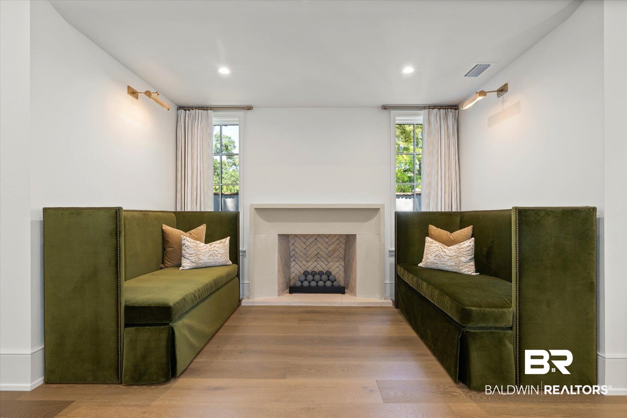 3 Canterbury Park Mobile, AL 36608 - Photo 11 of 43 Sitting room featuring healthy amount of natural light, wood finished floors, a fireplace with raised hearth, and recessed lighting