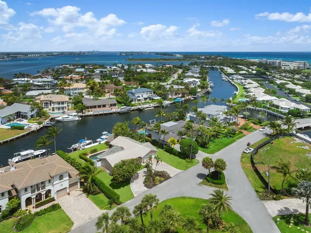 an aerial view of residential building with outdoor space and lake view