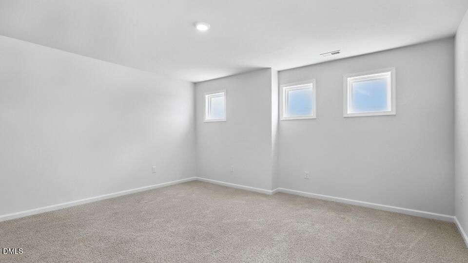 7589 Percussion Drive Apex, NC 27539 - Photo 15 of 33 an empty room with a empty space and window
