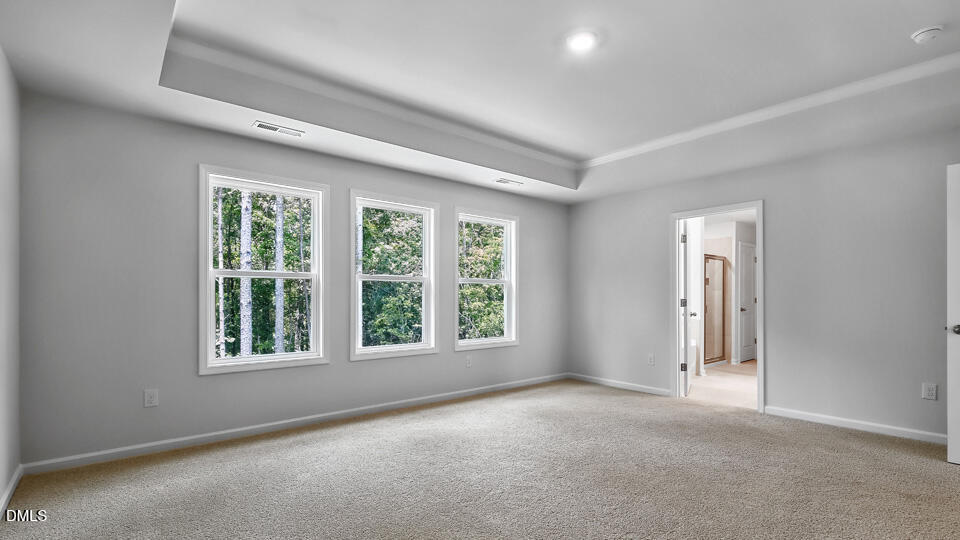 7589 Percussion Drive Apex, NC 27539 - Photo 18 of 33 an empty room with windows and closet