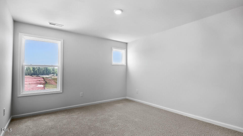 7589 Percussion Drive Apex, NC 27539 - Photo 20 of 33 an empty room with windows