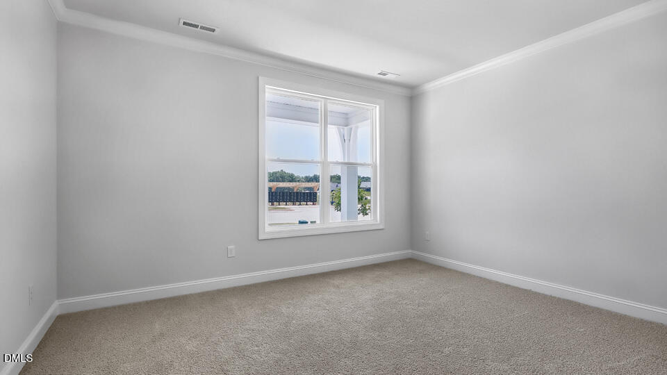 7589 Percussion Drive Apex, NC 27539 - Photo 22 of 33 an empty room with a window