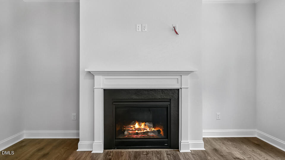 7589 Percussion Drive Apex, NC 27539 - Photo 4 of 33 a room with a fireplace