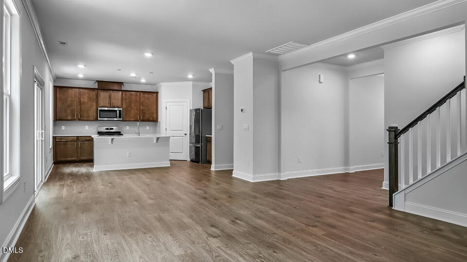 7589 Percussion Drive Apex, NC 27539 - Photo 5 of 33 a view of kitchen with wooden floor and electronic appliances