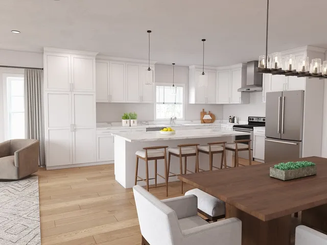 a kitchen with stainless steel appliances granite countertop a refrigerator a sink a stove a dining table and chairs