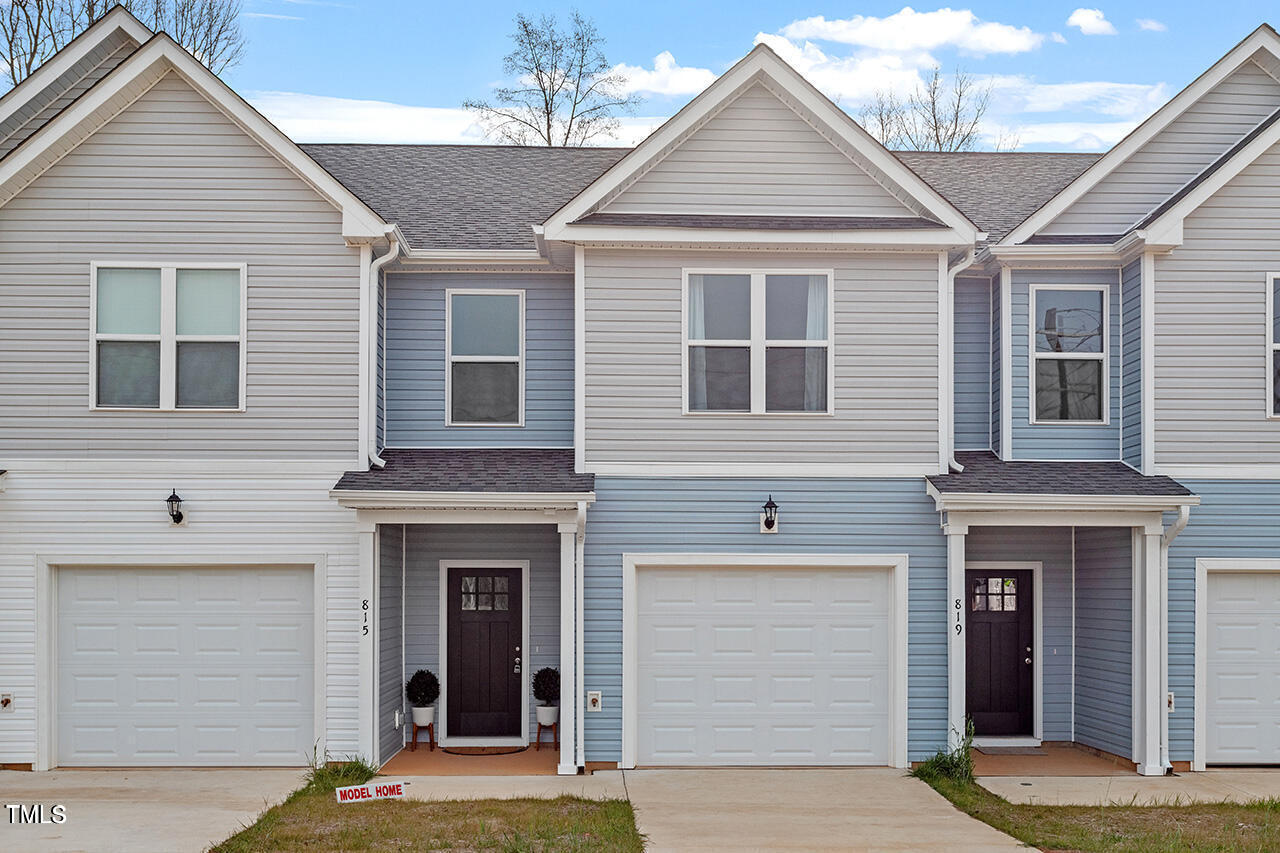 a front view of a house with a garage