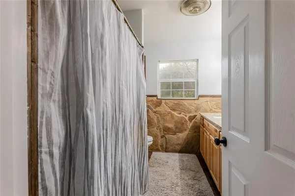a view of a hallway with windows