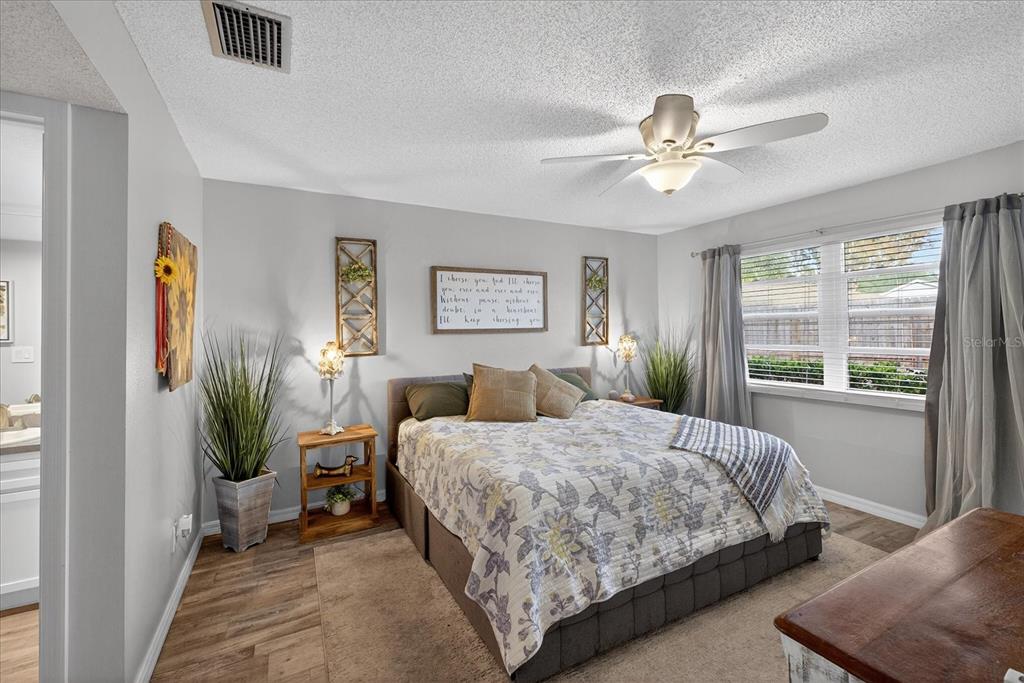 3230 Teeside Drive New Port Richey, FL 34655 - Photo 12 of 32 a bedroom with a bed and large window