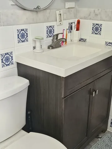 a bathroom with a sink and a toilet