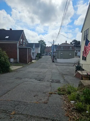 a view of a house next to a yard