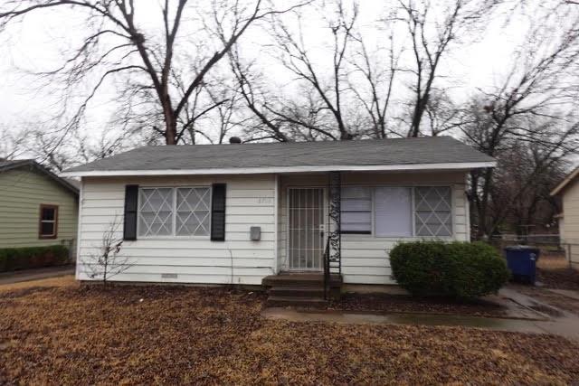 a front view of a house with stairs