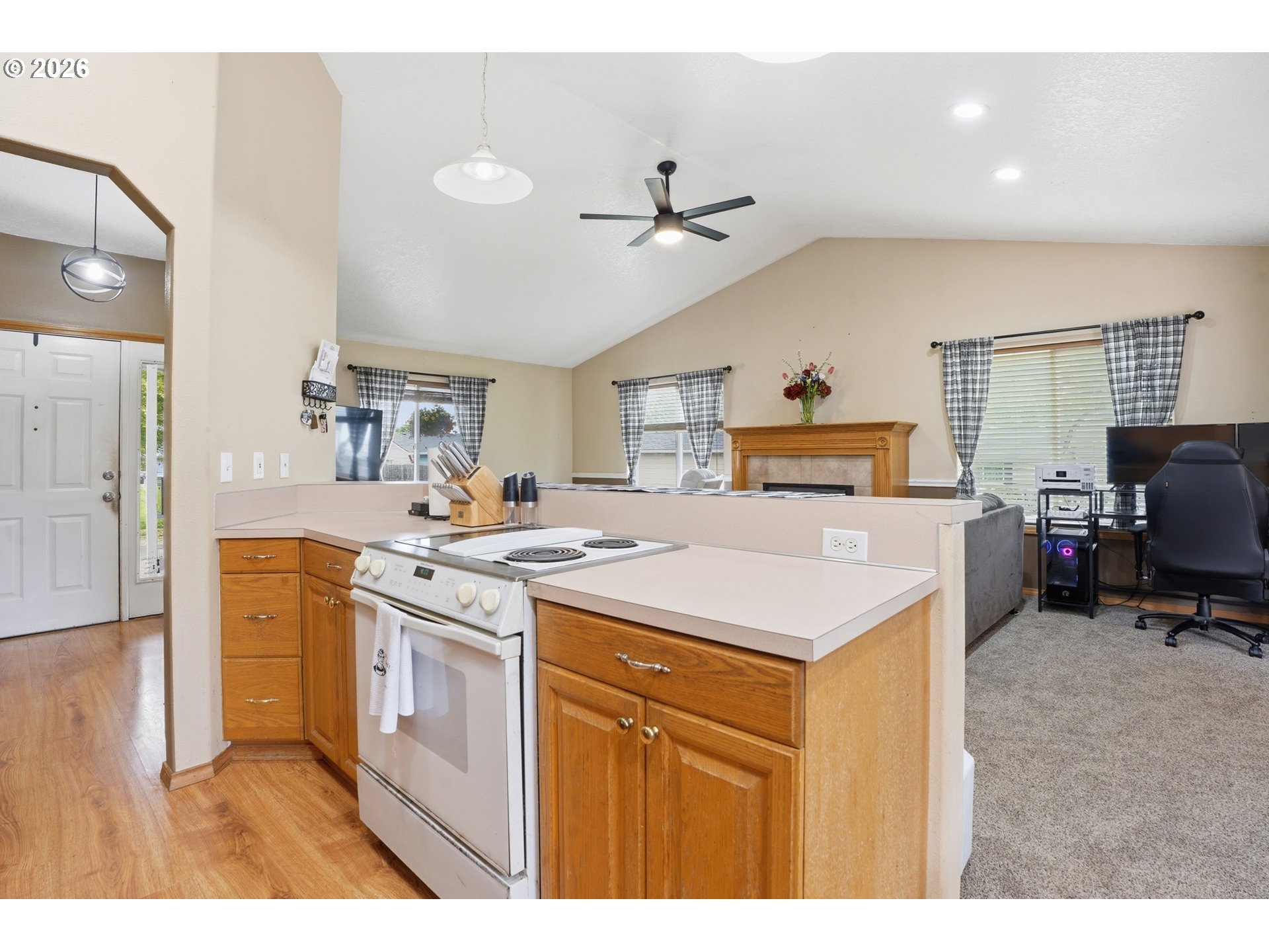 105 Toliver Road Molalla, OR 97038 - Photo 9 of 34 a kitchen with a stove a refrigerator and a sink