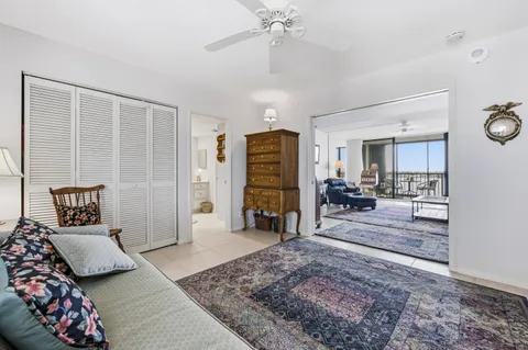 a bedroom with furniture and a rug