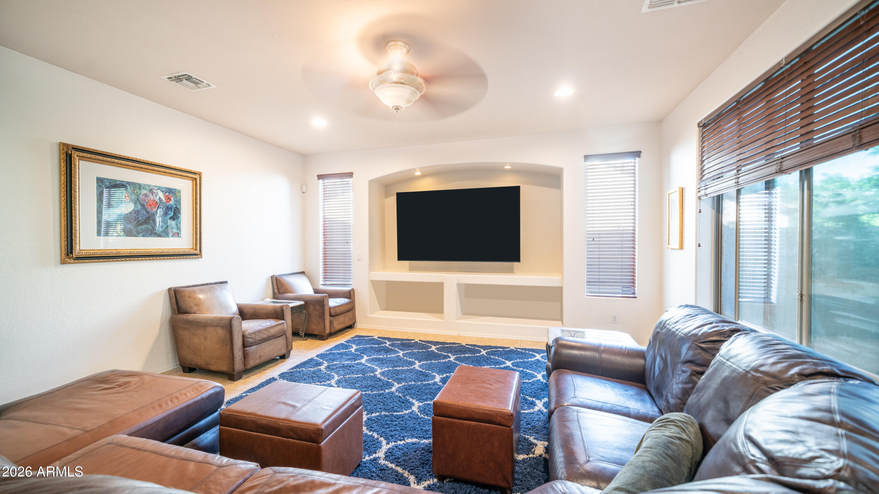 7609 South 18th Way Phoenix, AZ 85042 - Photo 11 of 32 a living room with furniture and a flat screen tv
