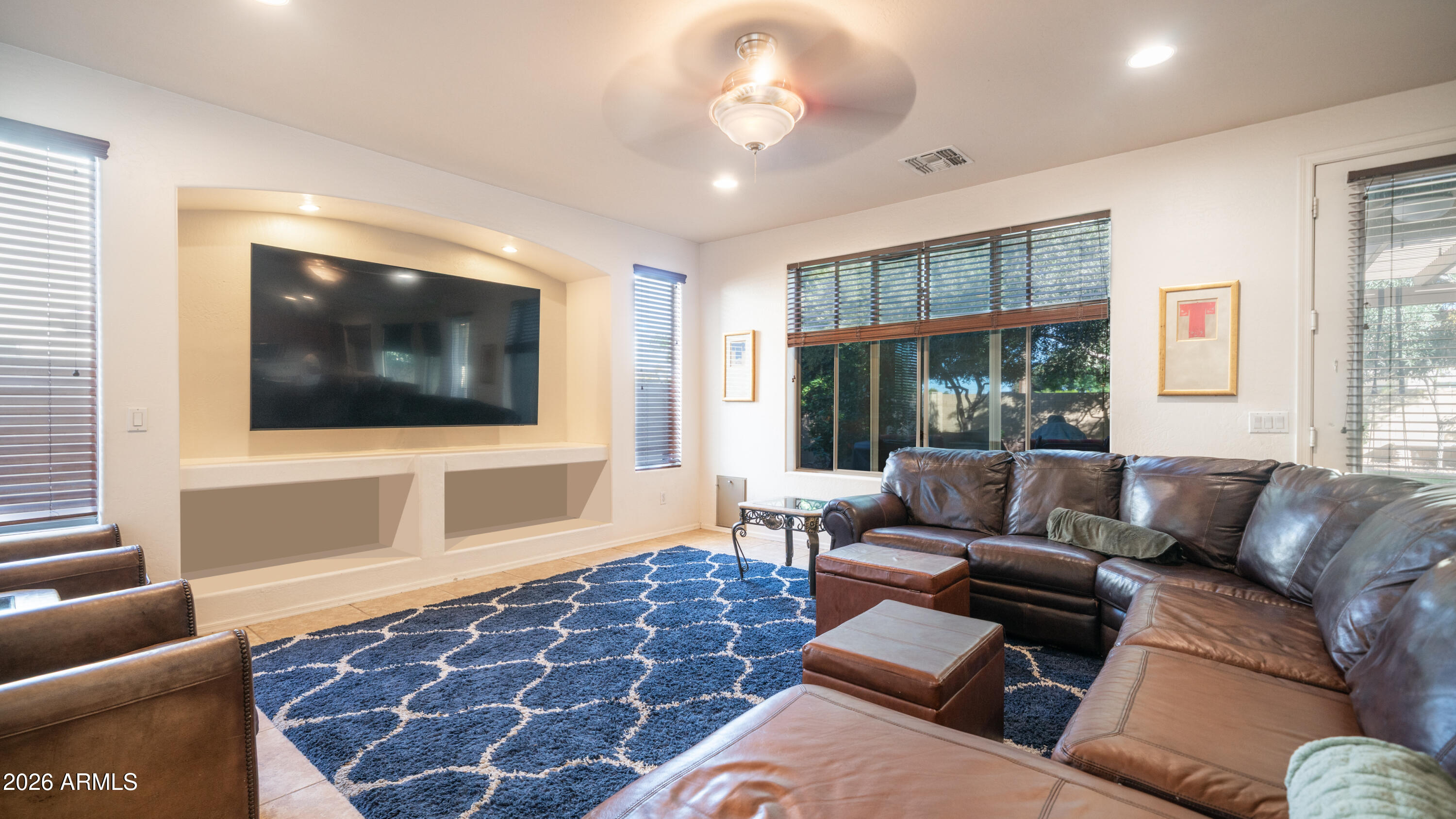 7609 South 18th Way Phoenix, AZ 85042 - Photo 12 of 32 a living room with furniture and a flat screen tv