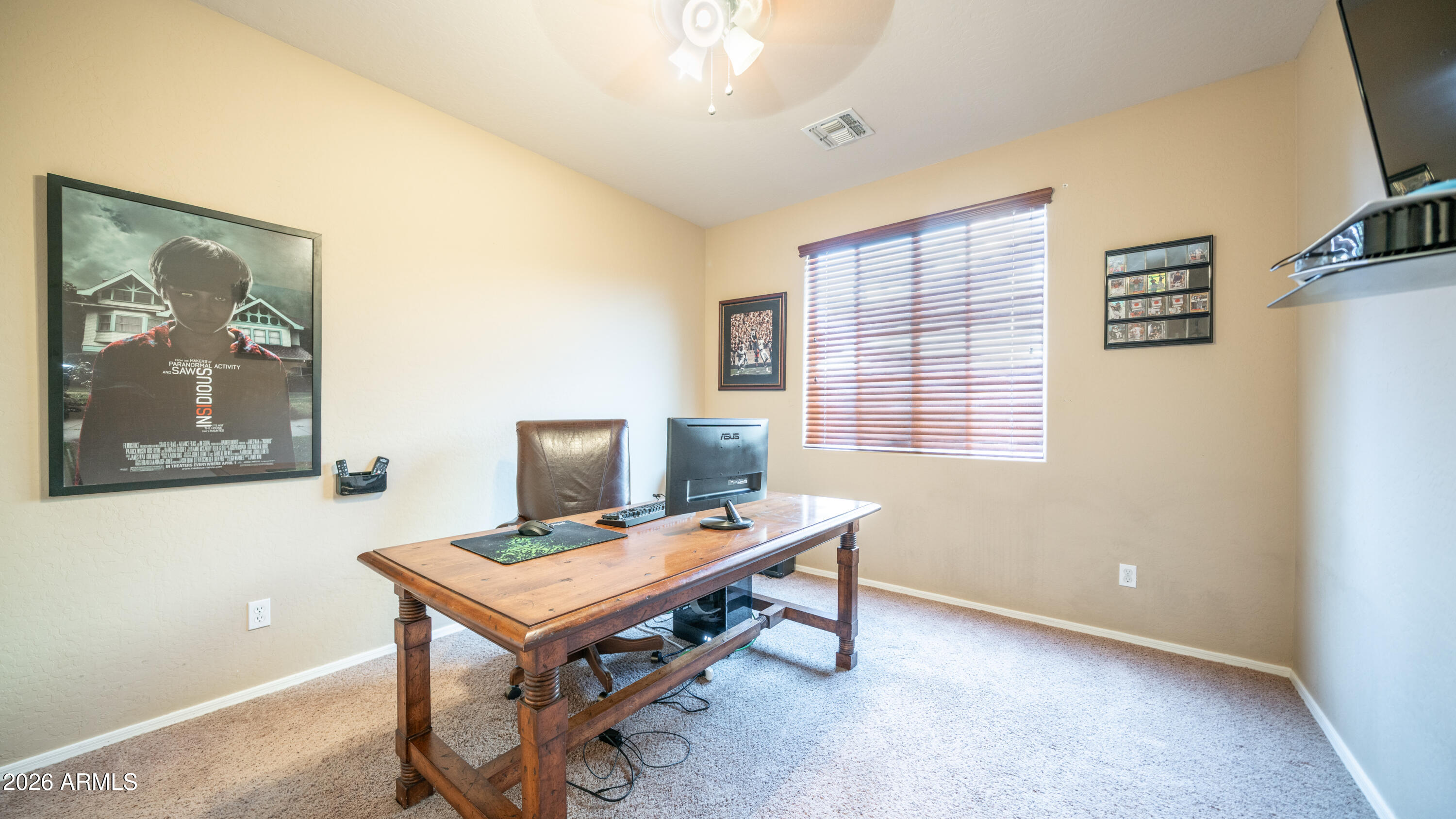 7609 South 18th Way Phoenix, AZ 85042 - Photo 13 of 32 a view of a workspace with furniture and a window