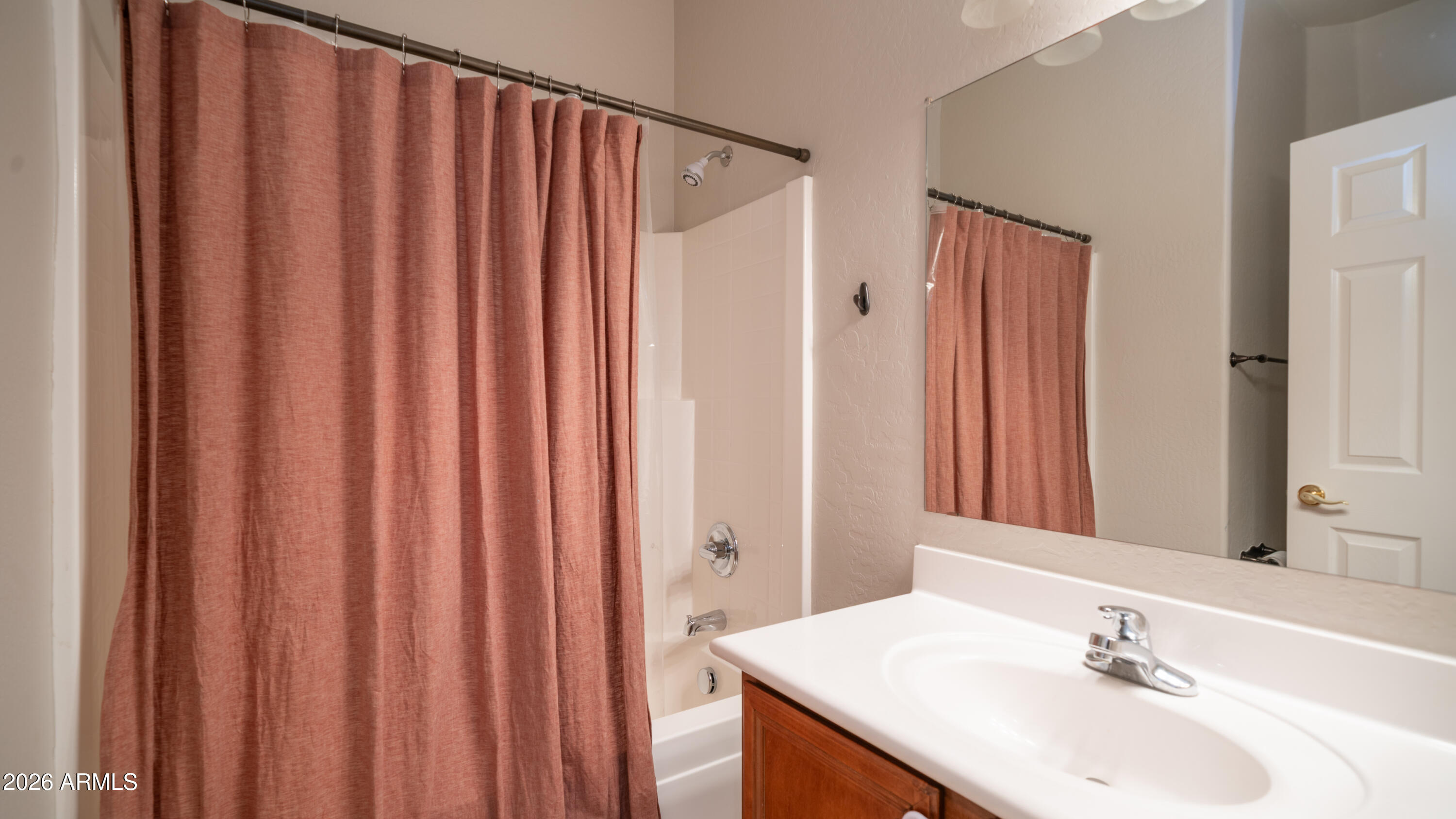 7609 South 18th Way Phoenix, AZ 85042 - Photo 14 of 32 a bathroom with a sink and a mirror